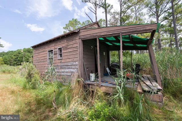 an aerial view of residential house with outdoor space and swimming pool