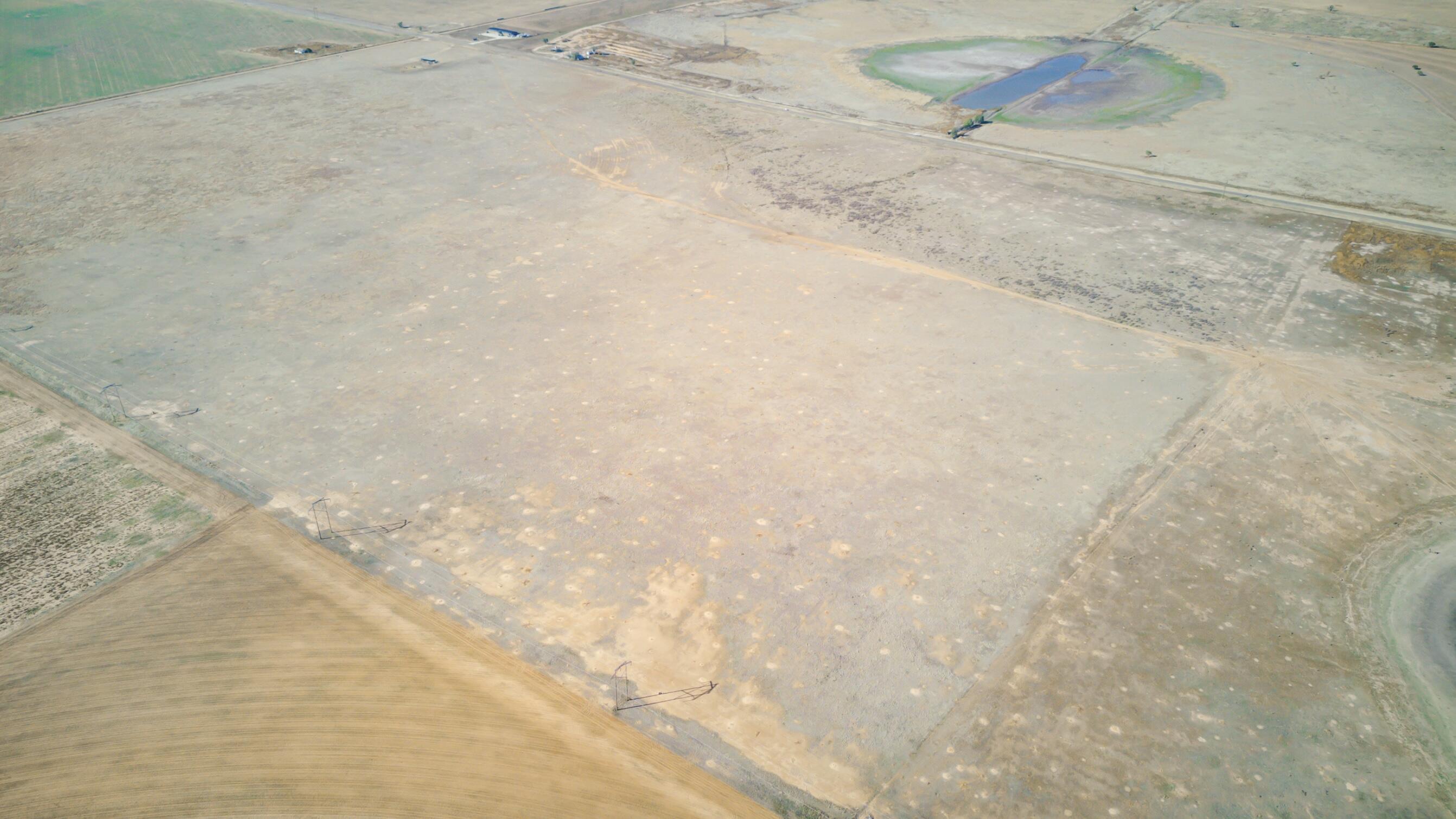 54 / Tract 3 Abernathy, TX 79311 - Photo 11 of 19 a view of a dry field with trees in the background