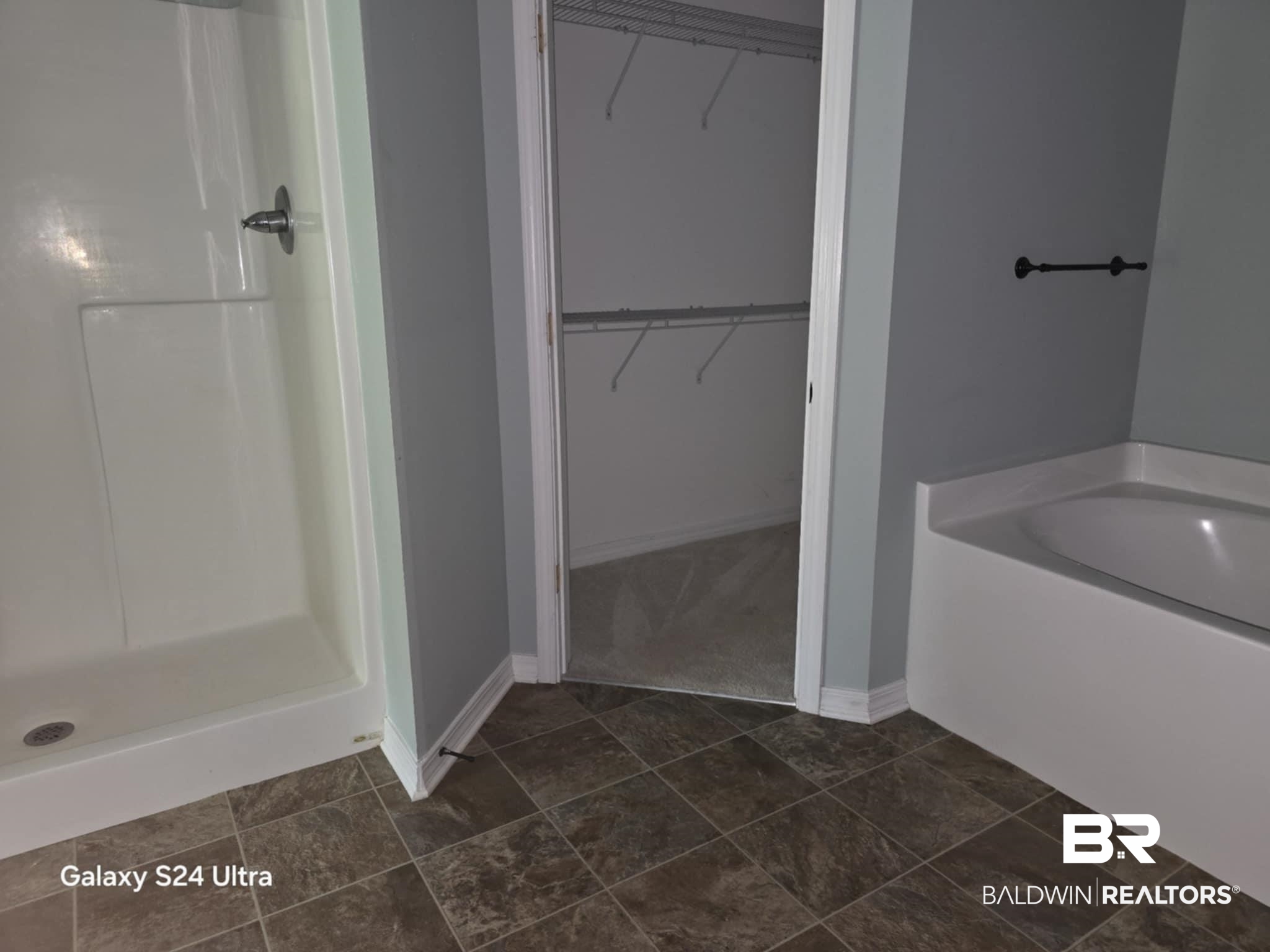 546 Wolf Log Road Flomaton, AL 36441 - Photo 7 of 15 Bathroom with tile patterned floors and separate shower and tub