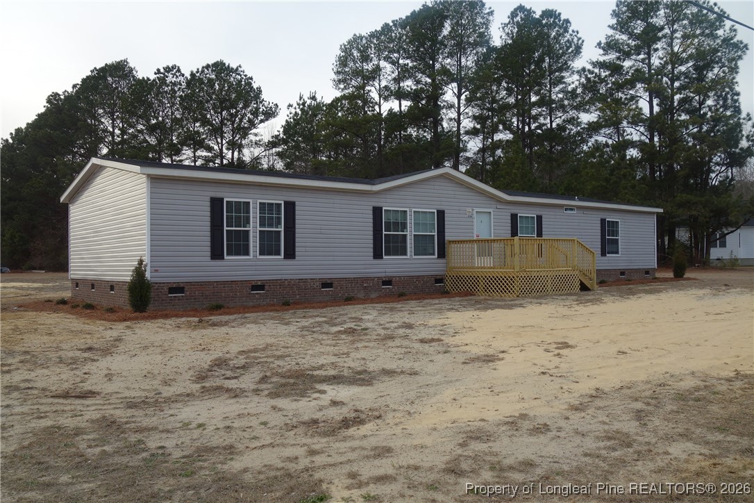1438 Twisted Hickory Road Elizabethtown, NC 28337 - Photo 1 of 15 a house with trees in the background