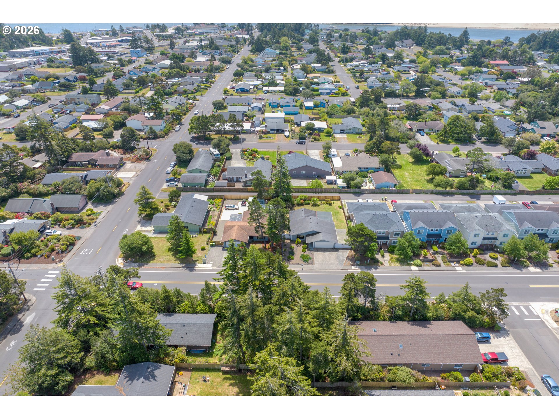 1142 9th Street Florence, OR 97439 - Photo 40 of 41 an aerial view of residential houses with outdoor space