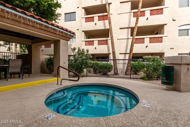 a view of a swimming pool with a lounge chairs