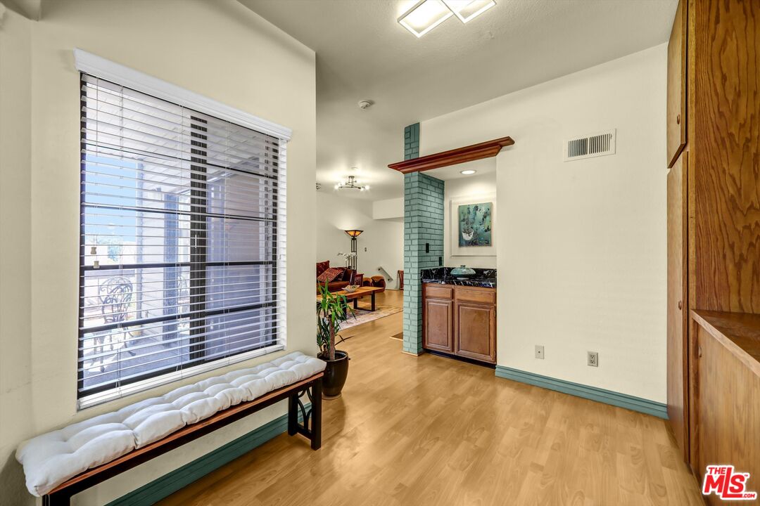 1313 Valley View Road, Unit 213 Glendale, CA 91202 - Photo 11 of 31 a living room with furniture and a window