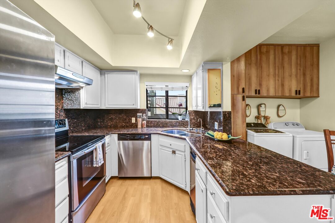 1313 Valley View Road, Unit 213 Glendale, CA 91202 - Photo 13 of 31 a kitchen with a sink stove and cabinets