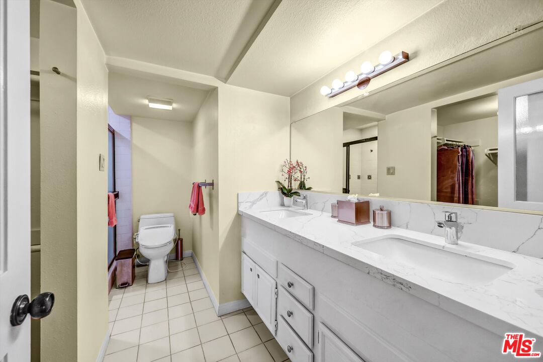 1313 Valley View Road, Unit 213 Glendale, CA 91202 - Photo 20 of 31 a spacious bathroom with a double vanity sink mirror and toilet