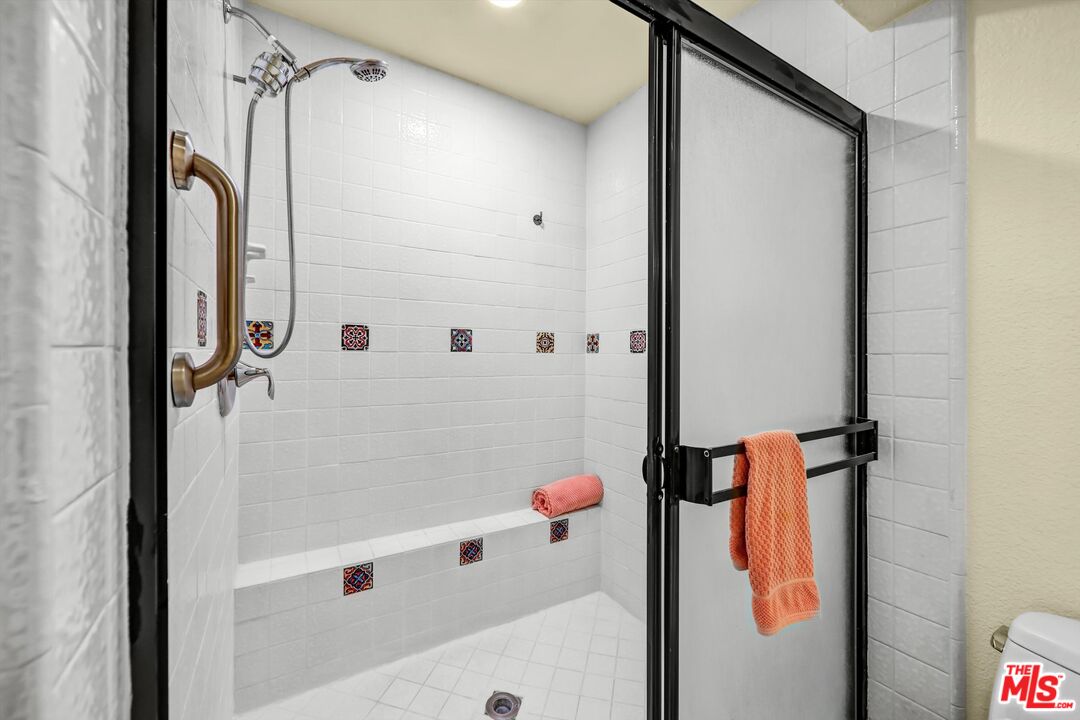 1313 Valley View Road, Unit 213 Glendale, CA 91202 - Photo 21 of 31 a bathroom with a tub and shower