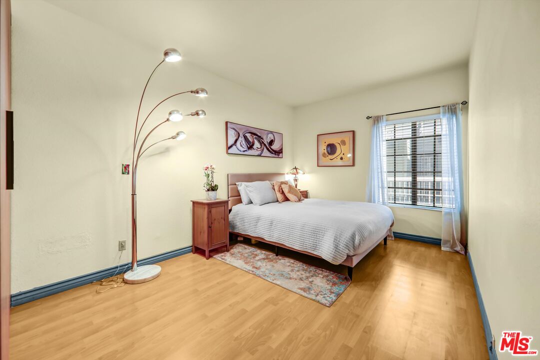 1313 Valley View Road, Unit 213 Glendale, CA 91202 - Photo 22 of 31 a bedroom with a bed and a window