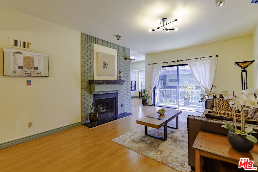 1313 Valley View Road, Unit 213 Glendale, CA 91202 - Photo 25 of 31 a living room with furniture and a fireplace