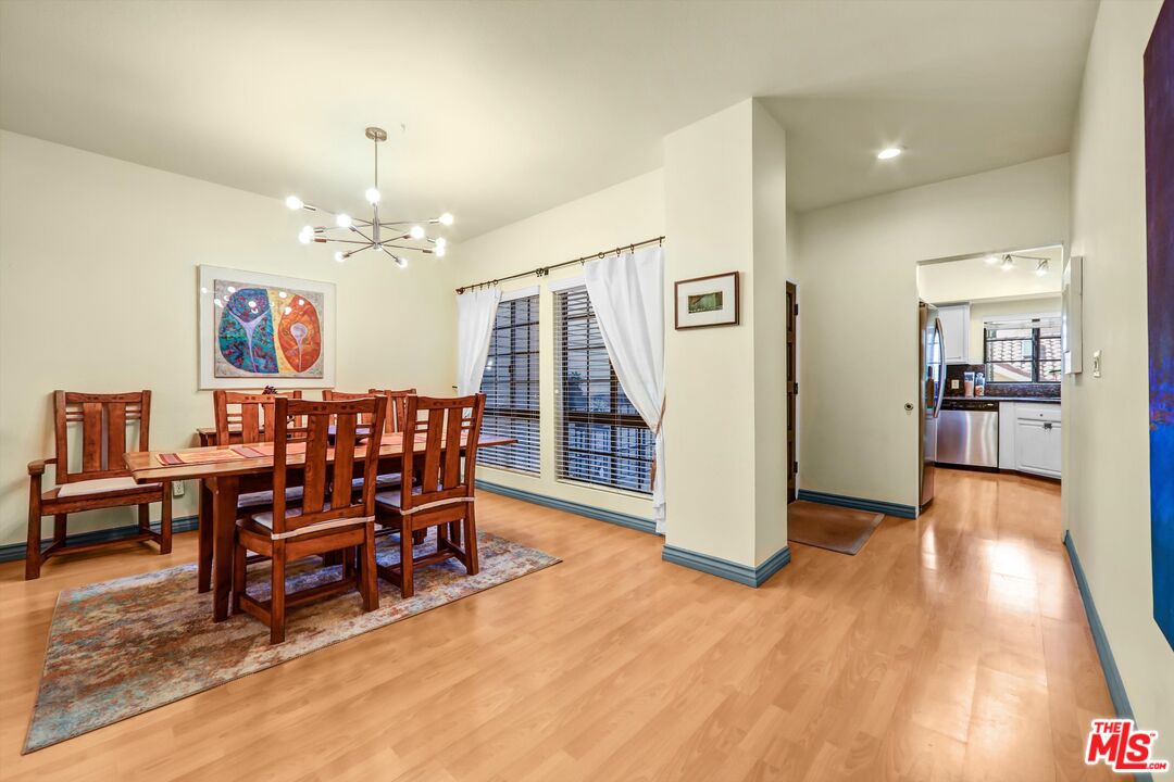 1313 Valley View Road, Unit 213 Glendale, CA 91202 - Photo 8 of 31 a view of a dining room with furniture and wooden floor