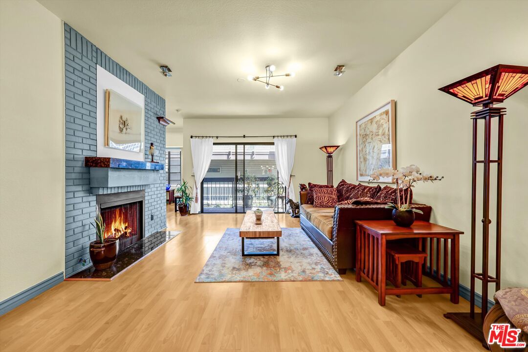1313 Valley View Road, Unit 213 Glendale, CA 91202 - Photo 9 of 31 a living room with furniture and a fireplace