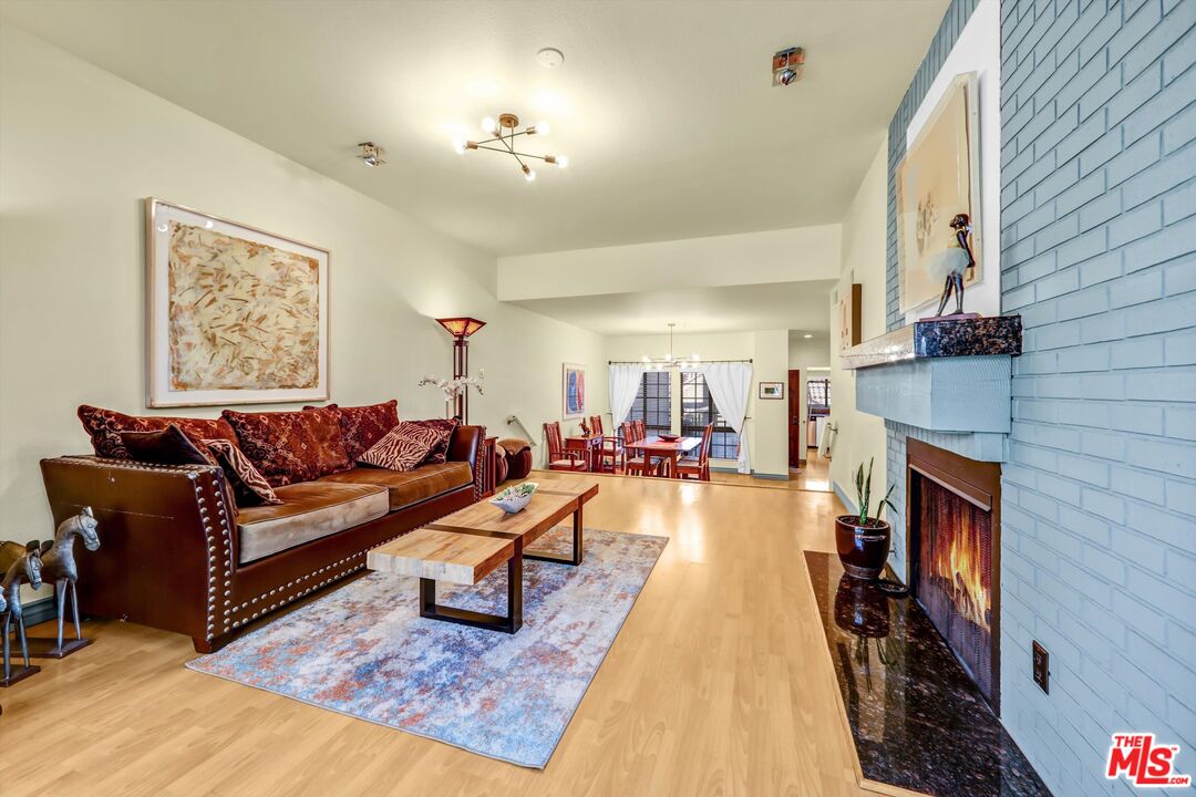 1313 Valley View Road, Unit 213 Glendale, CA 91202 - Photo 10 of 31 a living room with furniture and a fireplace