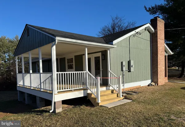 a view of porch with a yard