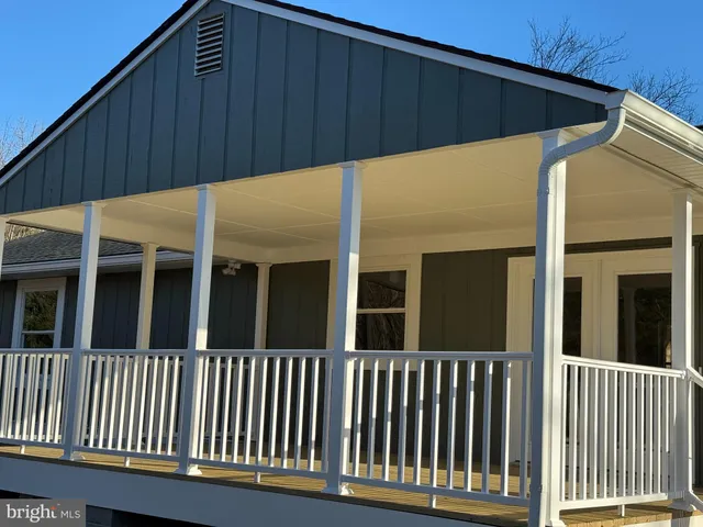 a view of a blue house and a window