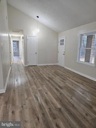 a view of an empty room and window