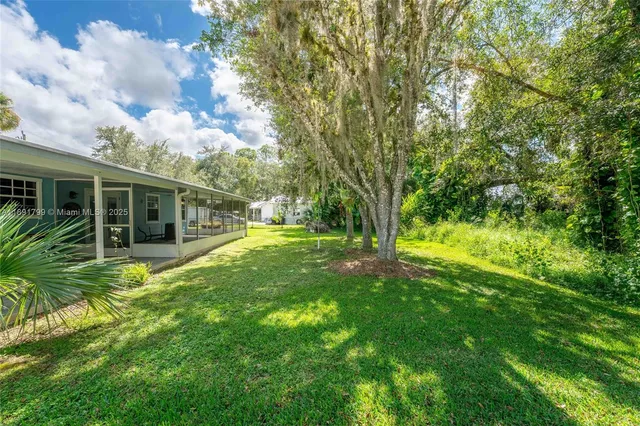 a view of backyard with green space