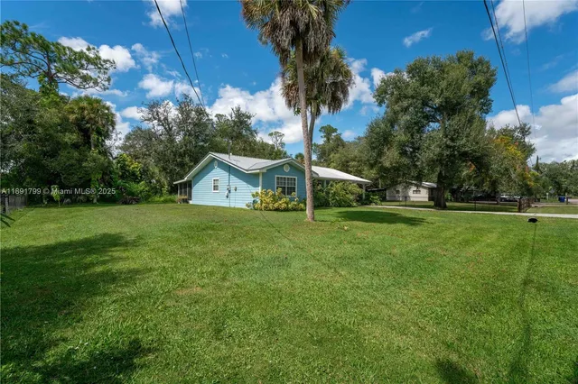 a view of a house with a tiny play ground