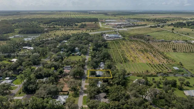 an aerial view of residential building and lake
