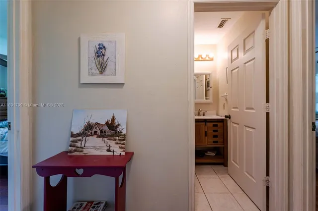 a view of a hallway with seating area