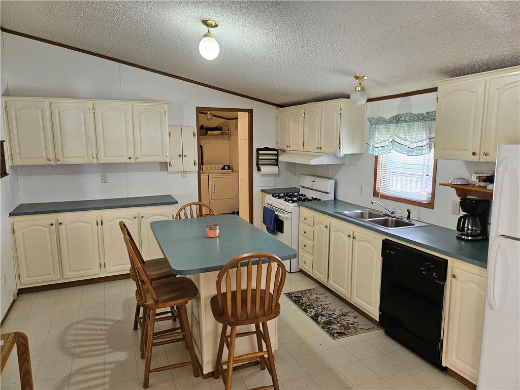 723 Joy Lane Butler, PA 16001 - Photo 11 of 41 a kitchen with stainless steel appliances granite countertop a stove a sink dishwasher a refrigerator and white cabinets with wooden floor