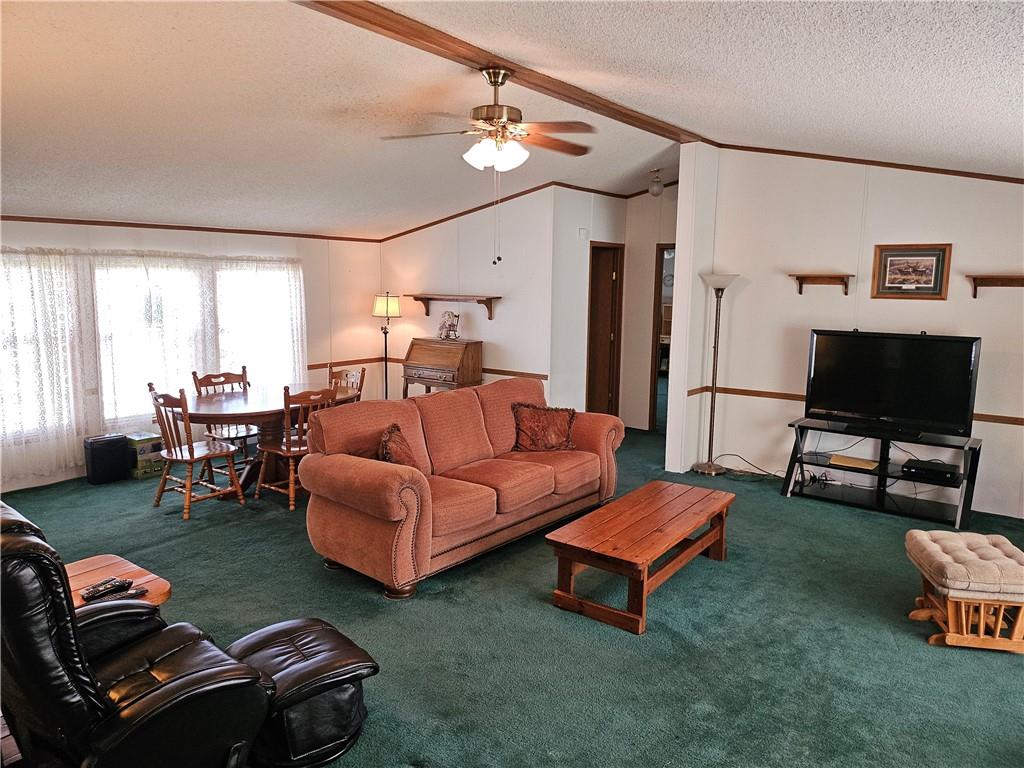 723 Joy Lane Butler, PA 16001 - Photo 15 of 41 a living room with furniture a flat screen tv and a window