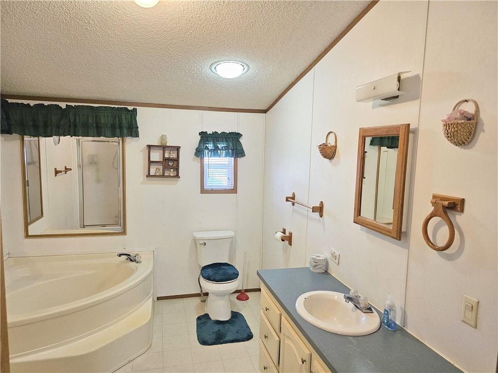 723 Joy Lane Butler, PA 16001 - Photo 23 of 41 a bathroom with a granite countertop sink and a mirror