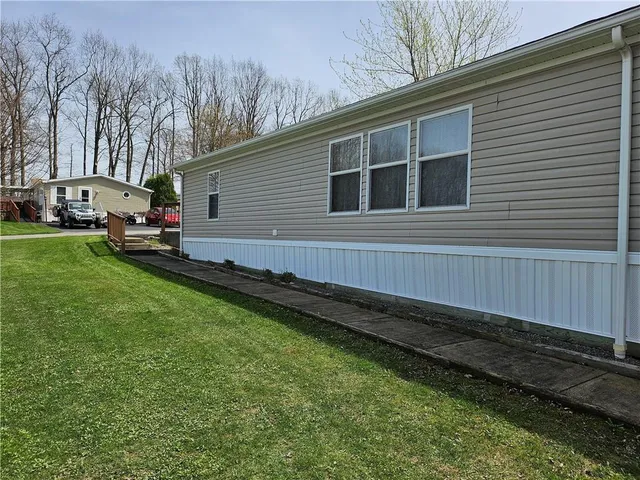 a backyard view with hardwood wall and trees