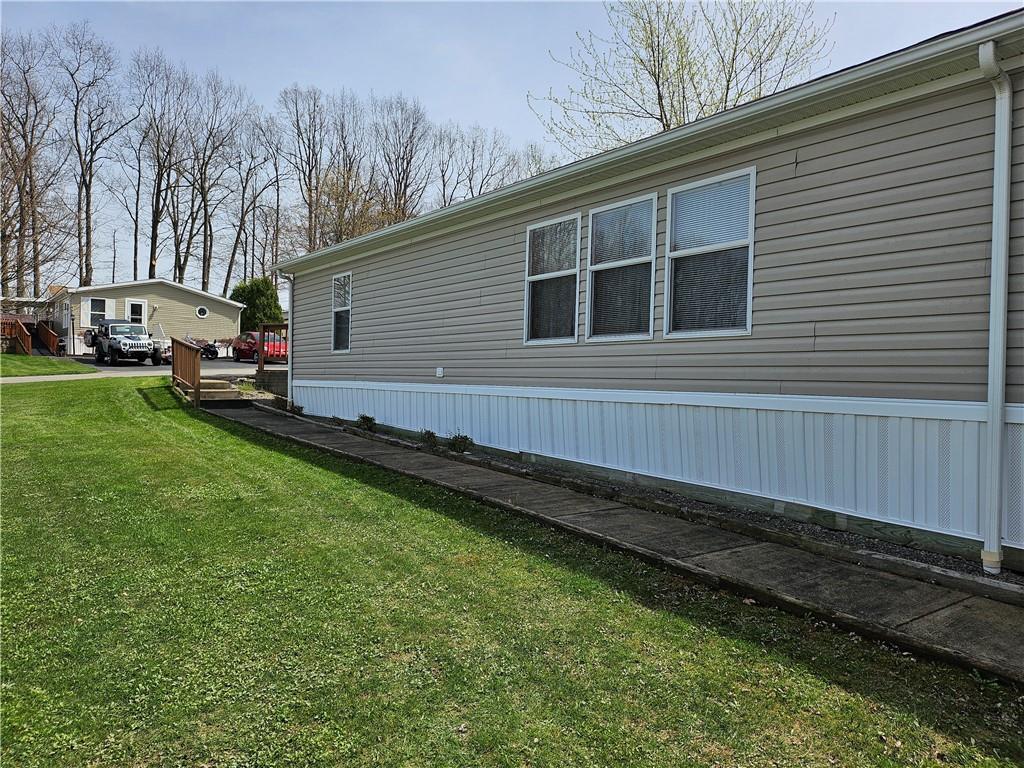 723 Joy Lane Butler, PA 16001 - Photo 40 of 41 a backyard view with hardwood wall and trees