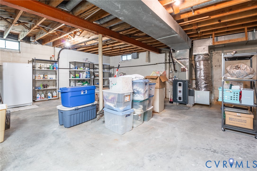8413 Cherokee Road Richmond, VA 23235 - Photo 25 of 29 Unfinished basement featuring exposed ceiling jois