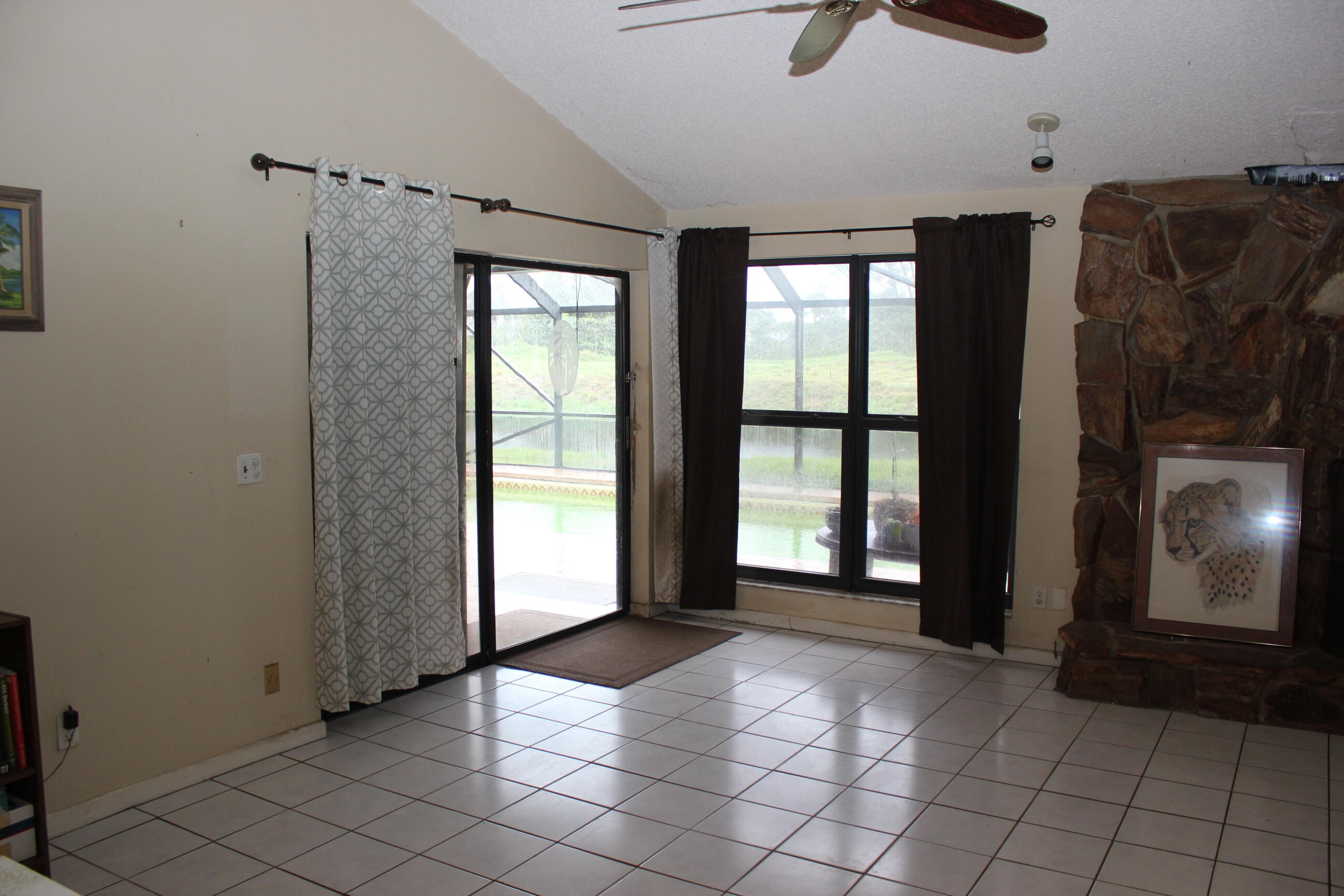 4981 Serafica Drive Lake Worth, FL 33461 - Photo 20 of 44 a view of livingroom with furniture and window