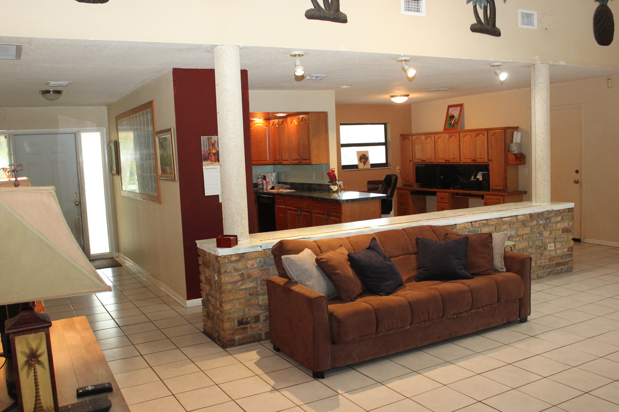 4981 Serafica Drive Lake Worth, FL 33461 - Photo 23 of 44 a living room with furniture and a flat screen tv