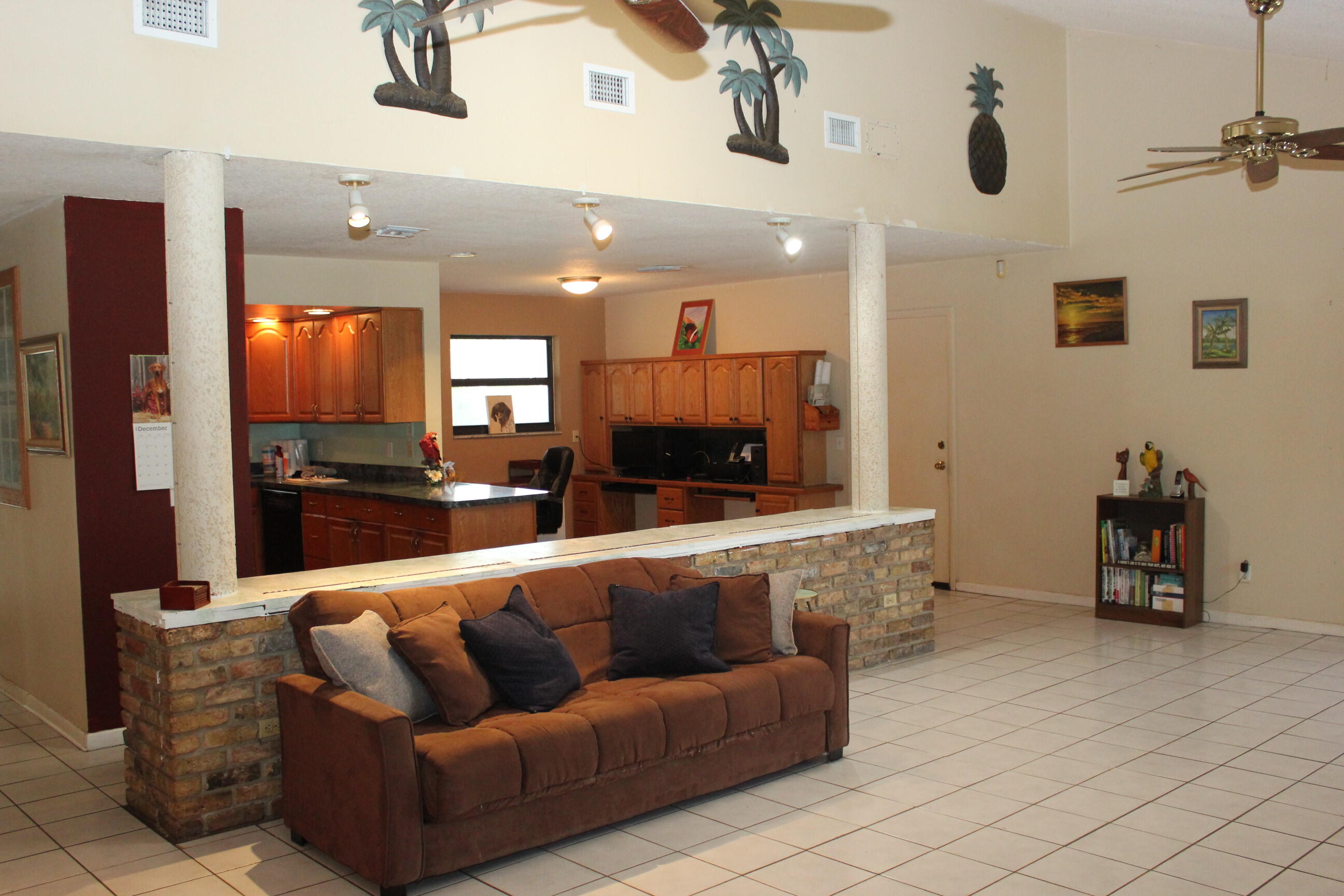 4981 Serafica Drive Lake Worth, FL 33461 - Photo 24 of 44 a living room with furniture and a flat screen tv