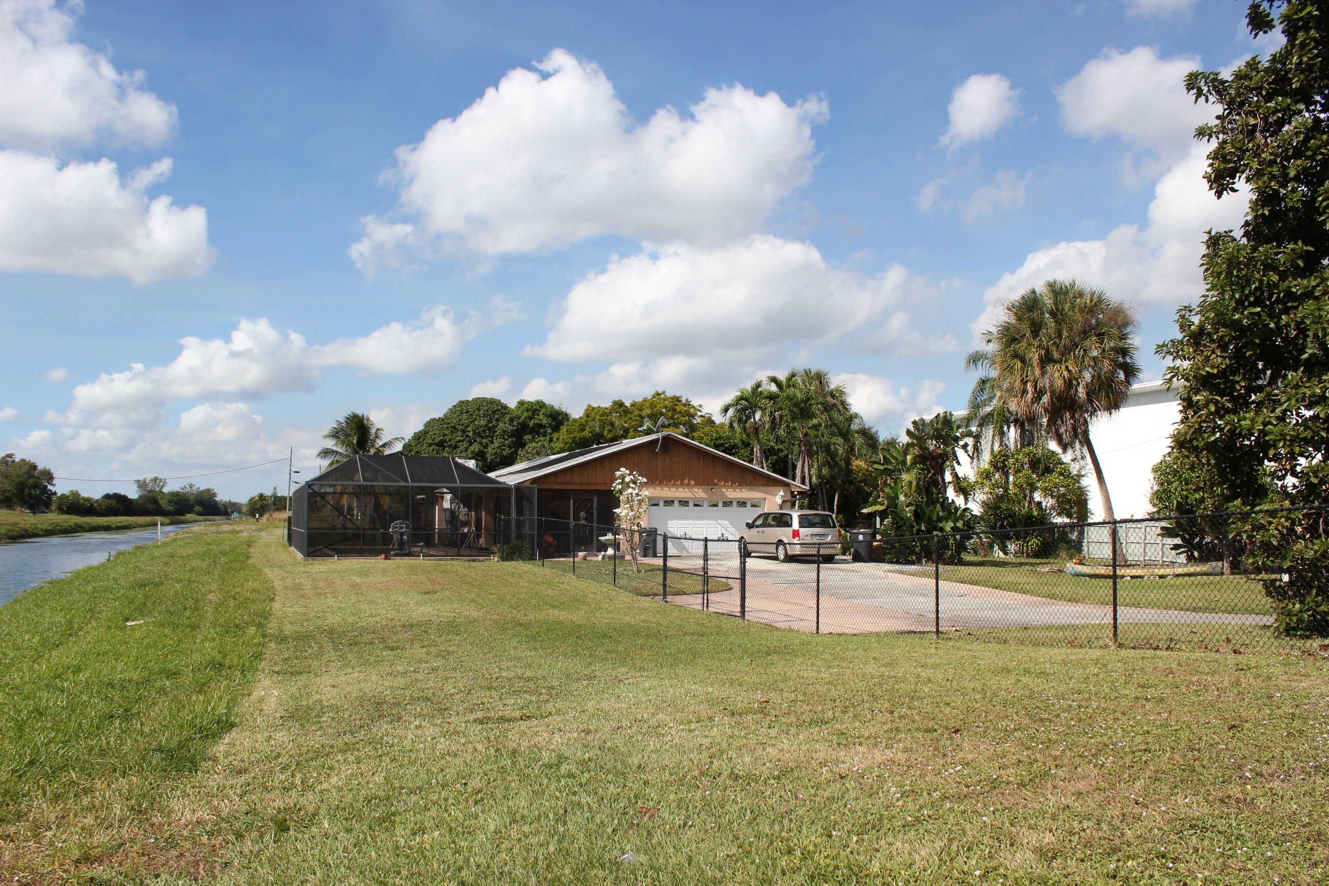 4981 Serafica Drive Lake Worth, FL 33461 - Photo 5 of 44 a view of a house with a yard