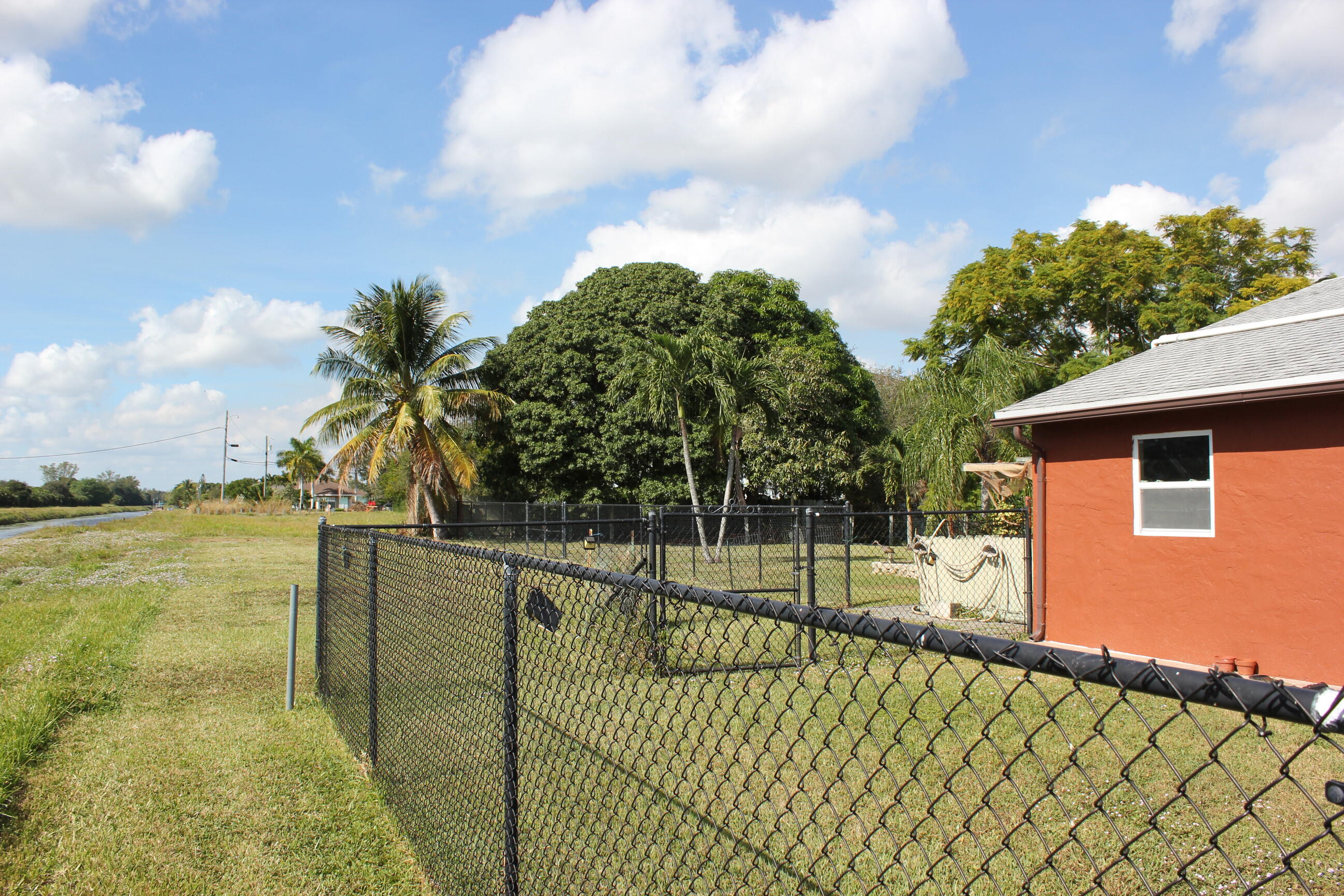 4981 Serafica Drive Lake Worth, FL 33461 - Photo 7 of 44 a view of a backyard