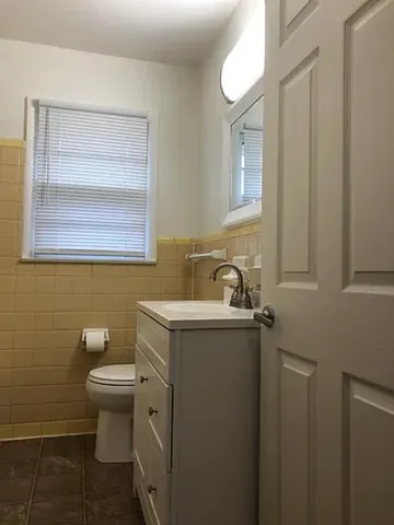 a bathroom with a toilet and a sink