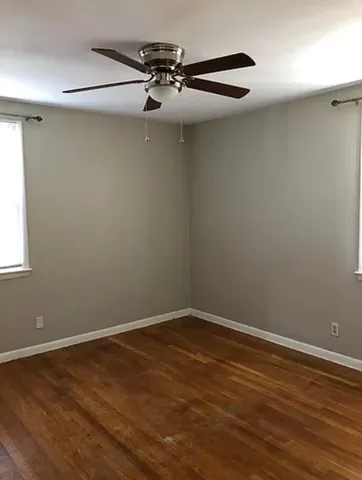 a bathroom with a sink toilet and window