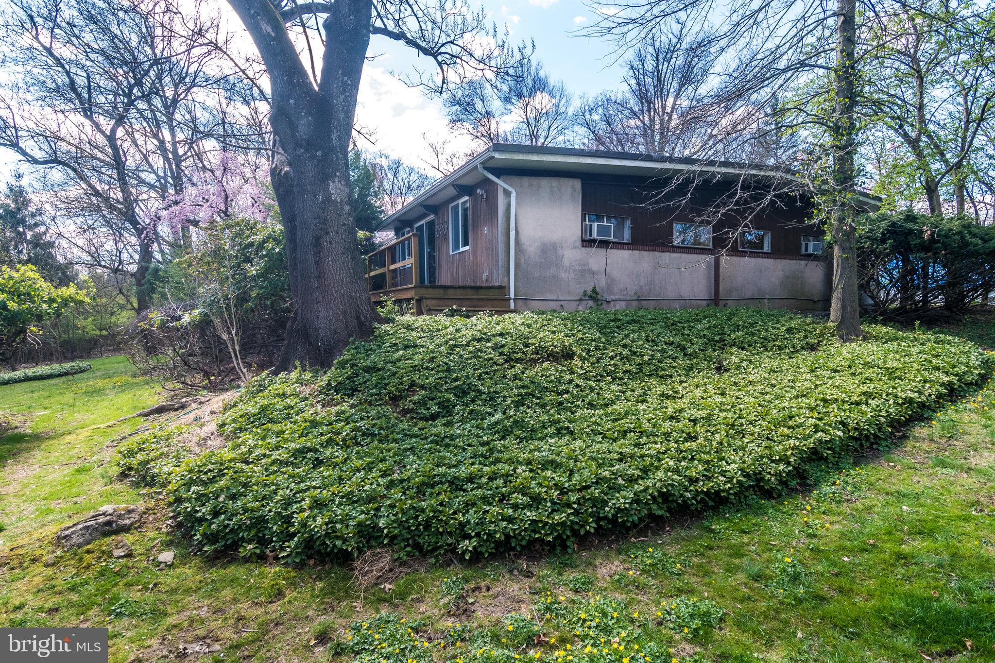 4453 Province Line Road Princeton, NJ 08540 - Photo 1 of 22 a front view of a house with garden