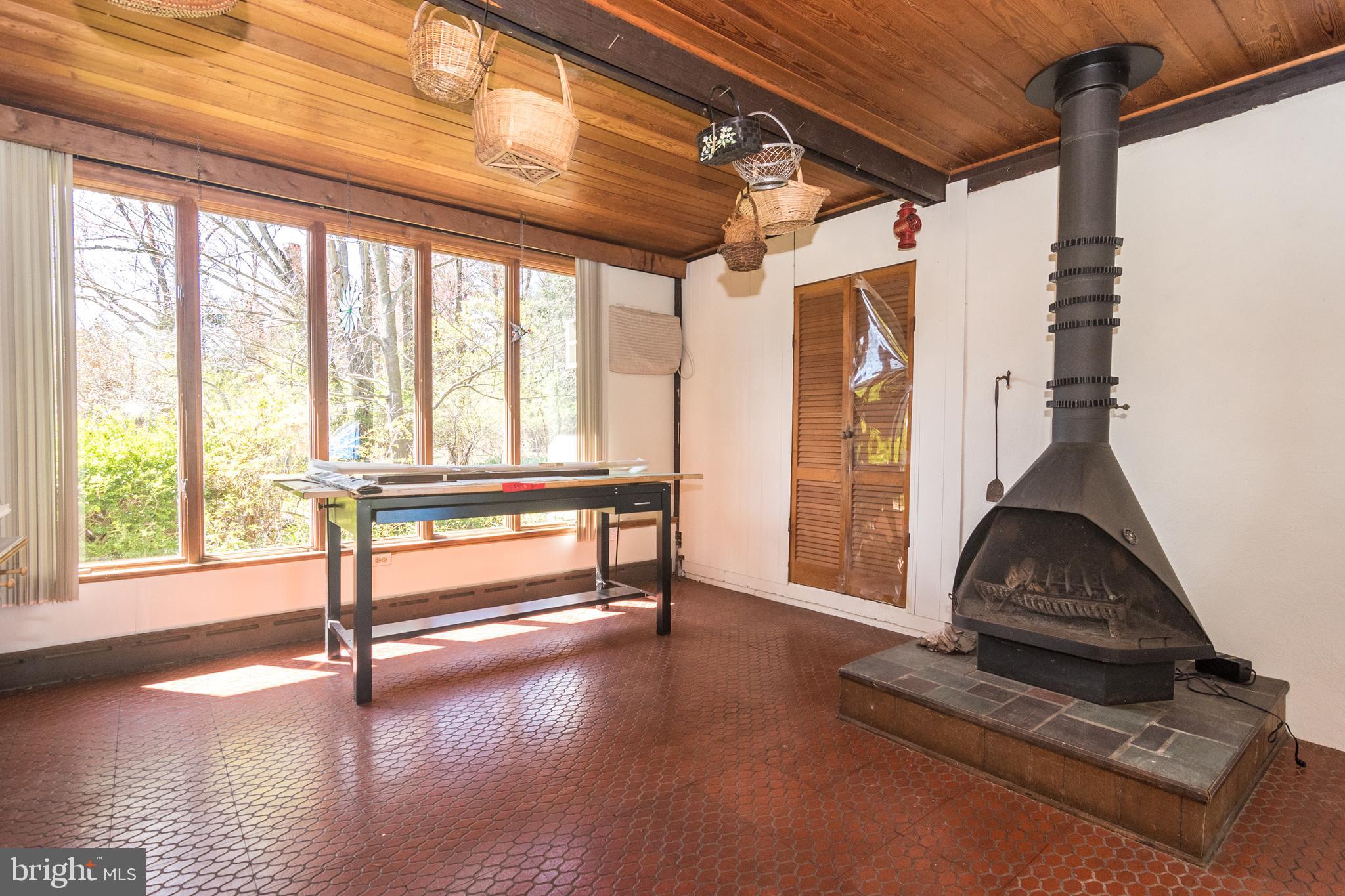 4453 Province Line Road Princeton, NJ 08540 - Photo 11 of 22 a living room with wooden floor furniture and a large window