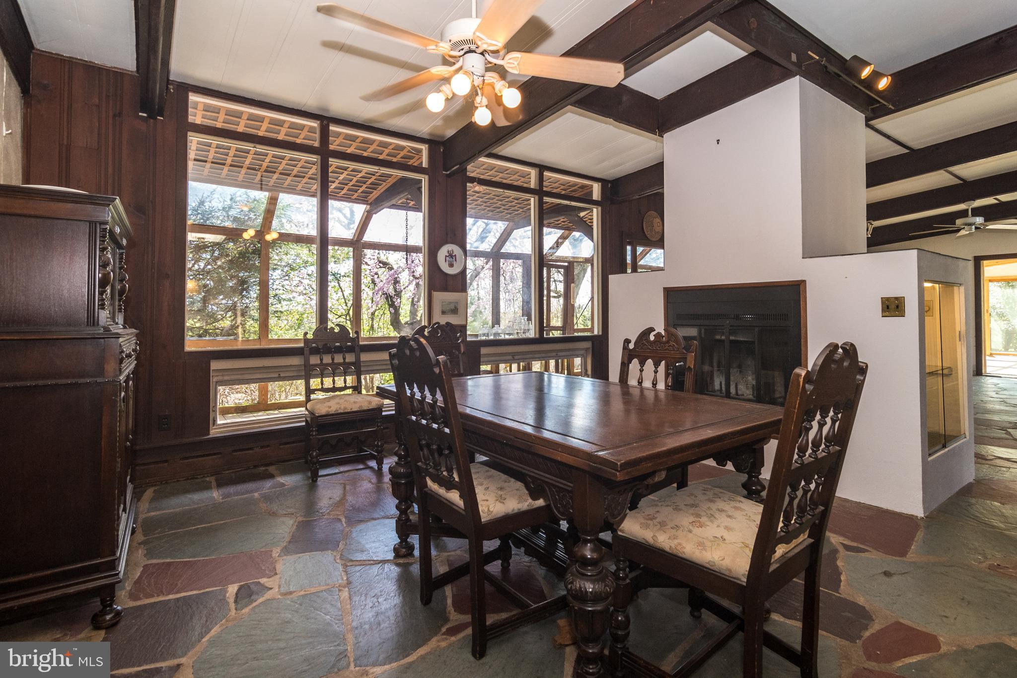 4453 Province Line Road Princeton, NJ 08540 - Photo 6 of 22 a dining room with furniture a chandelier and wooden floor