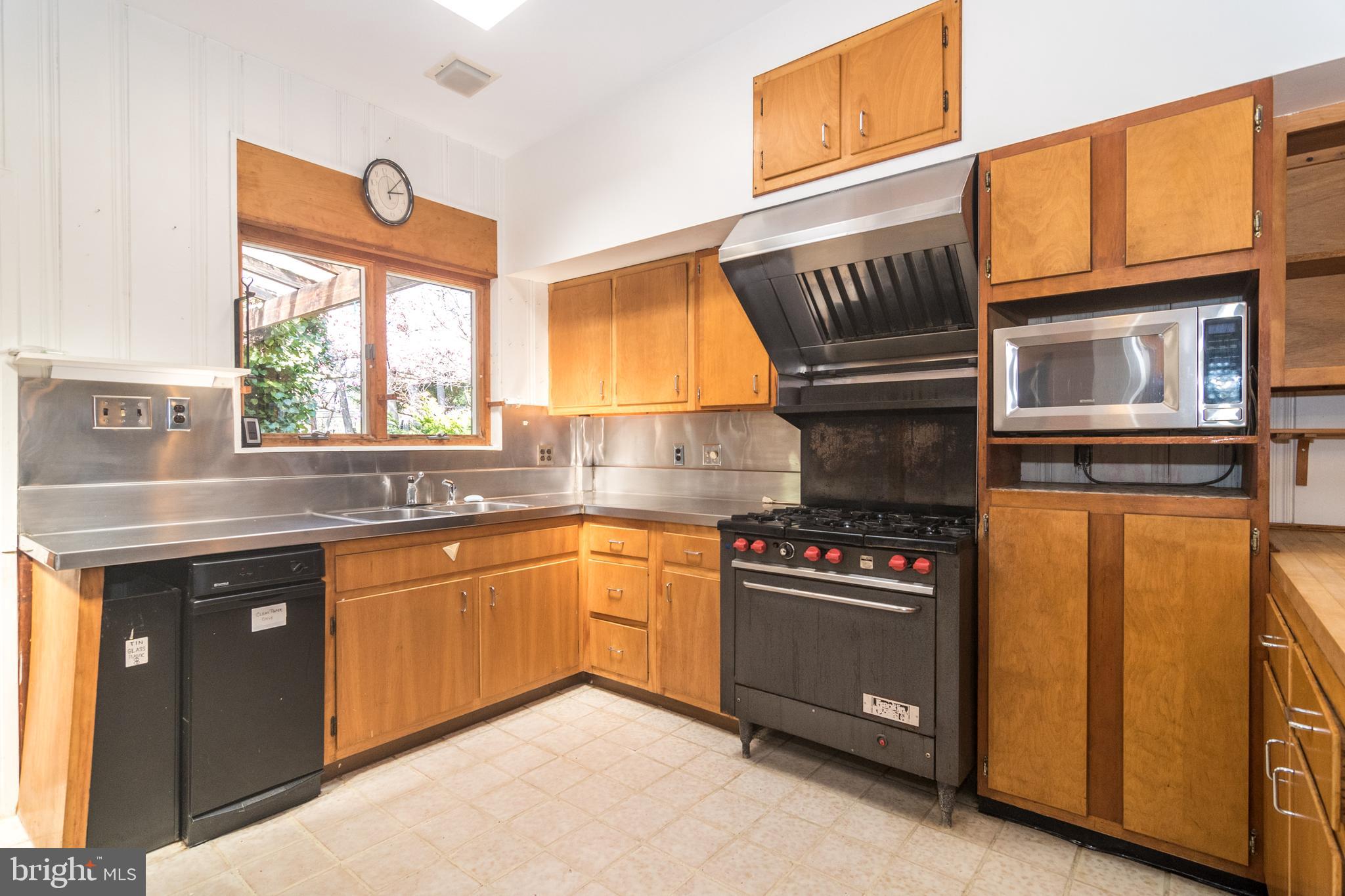 4453 Province Line Road Princeton, NJ 08540 - Photo 7 of 22 a kitchen with granite countertop a stove and a sink