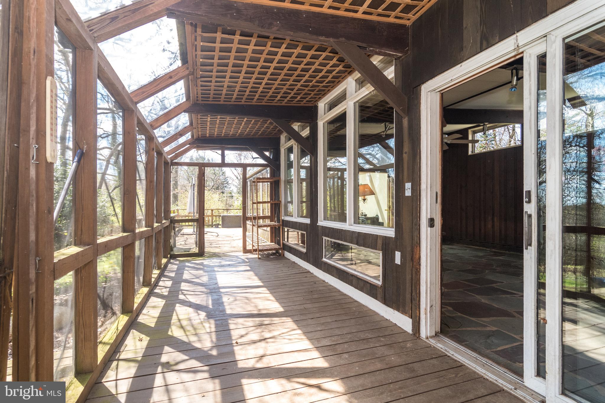 4453 Province Line Road Princeton, NJ 08540 - Photo 10 of 22 a view of a porch with a table and chairs