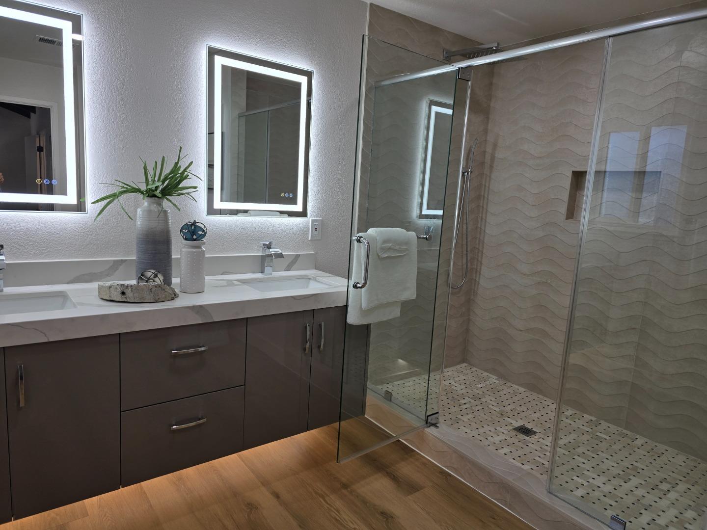 3575 Lehigh Drive, Unit 25 Santa Clara, CA 95051 - Photo 12 of 29 a bathroom with a shower sink and mirror