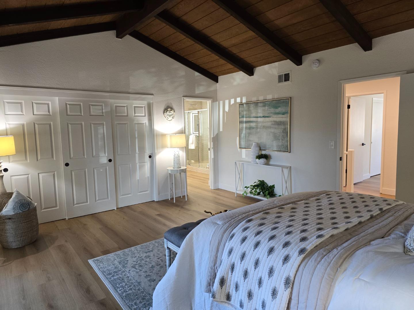 3575 Lehigh Drive, Unit 25 Santa Clara, CA 95051 - Photo 10 of 29 a bedroom with a bed and a chandelier