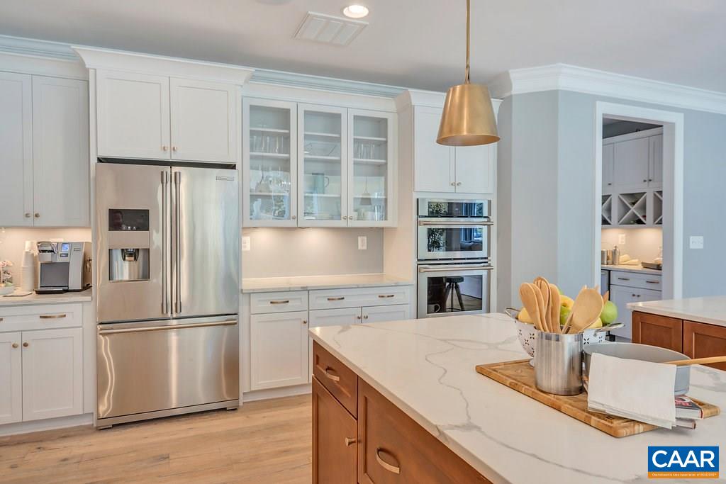 2134 Ridgetop Drive Charlottesville, VA 22903 - Photo 19 of 49 a kitchen with stainless steel appliances granite countertop a refrigerator and a stove top oven