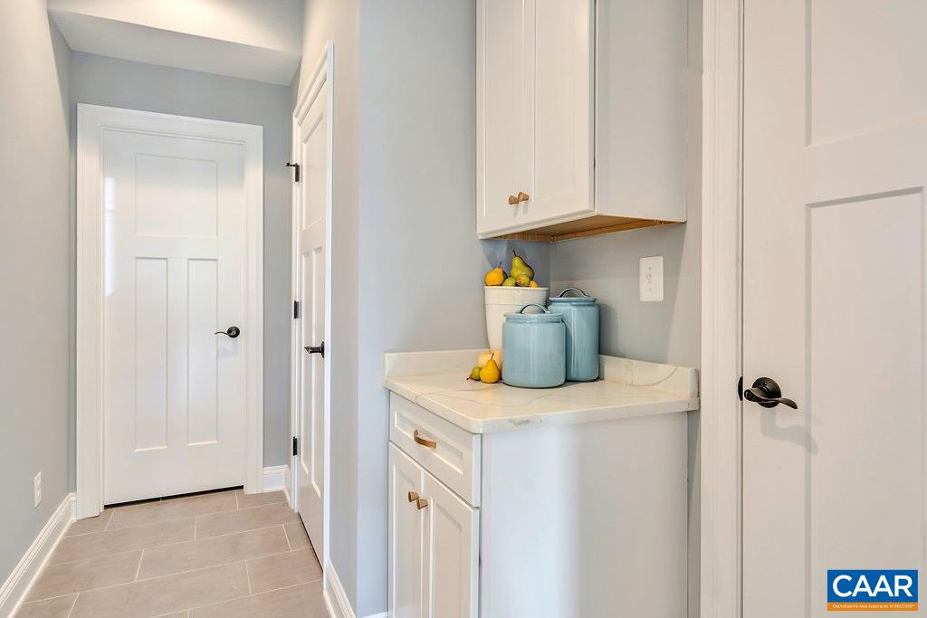 2134 Ridgetop Drive Charlottesville, VA 22903 - Photo 21 of 49 a kitchen with a sink and a refrigerator