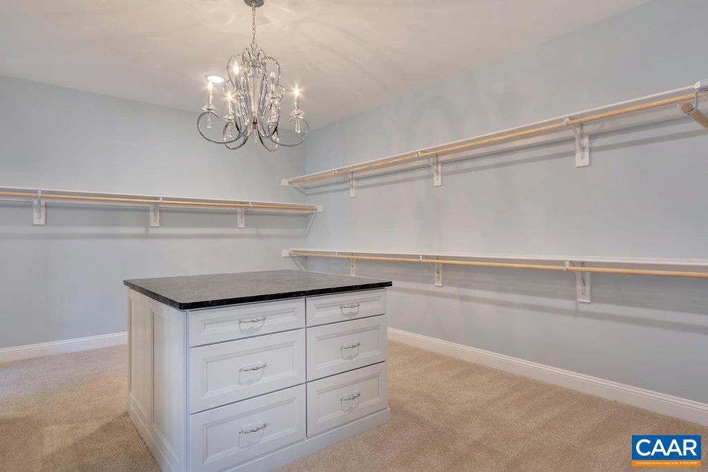 2134 Ridgetop Drive Charlottesville, VA 22903 - Photo 33 of 49 a view of a kitchen with a sink and chandelier
