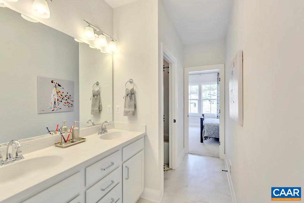 2134 Ridgetop Drive Charlottesville, VA 22903 - Photo 35 of 49 a en suite bathroom with a double vanity sink mirror and