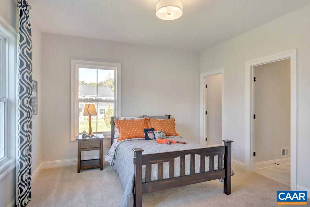 2134 Ridgetop Drive Charlottesville, VA 22903 - Photo 36 of 49 a bedroom with a bed and a window