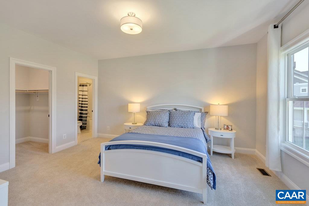 2134 Ridgetop Drive Charlottesville, VA 22903 - Photo 37 of 49 a bedroom with a bed and a window