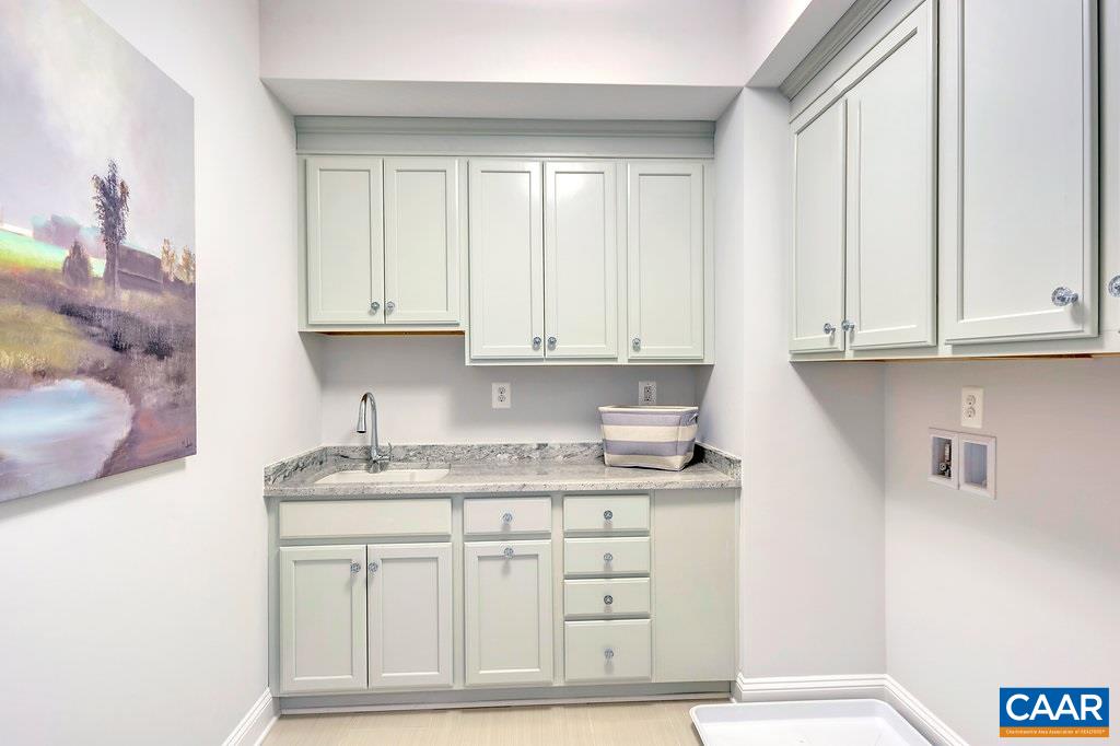 2134 Ridgetop Drive Charlottesville, VA 22903 - Photo 40 of 49 a kitchen with granite countertop white cabinets and sink
