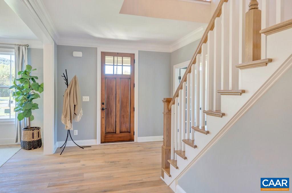 2134 Ridgetop Drive Charlottesville, VA 22903 - Photo 4 of 49 a view of an entryway with wooden floor and door